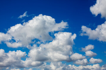 White clouds cumulus floating on blue sky for backgrounds concept