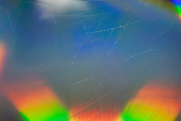 high res flash full frame macro photo of abstract scratched pastel iridescent holographic foil...