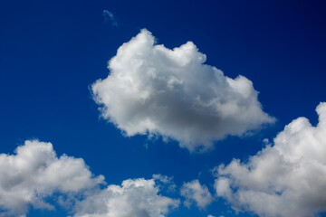 White clouds cumulus floating on blue sky for backgrounds concept