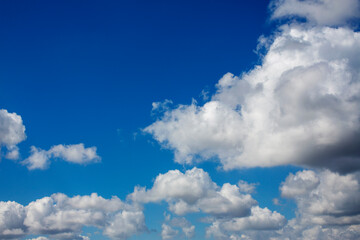 Naklejka na ściany i meble White clouds cumulus floating on blue sky for backgrounds concept