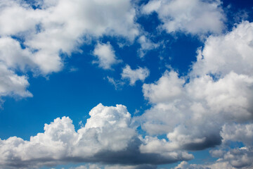 White clouds cumulus floating on blue sky for backgrounds concept