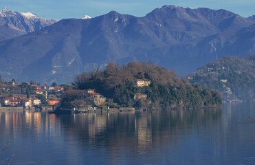 panoramic point of the Como lake with a view of the Comacina island and the ancient Ossuccio village .. lombardy, Italy