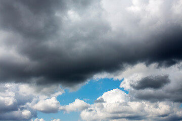 White clouds cumulus floating on blue sky for backgrounds concept