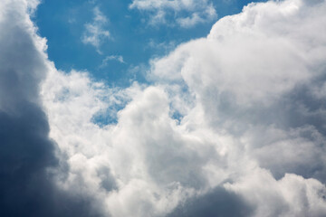 White clouds cumulus floating on blue sky for backgrounds concept