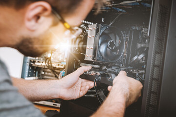 Technician fixing computer hardware. Computer maintenance upgrade and warranty repair service.
