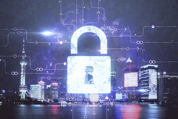 Lock icon hologram on city view with skyscrapers background multi exposure. Data security concept.