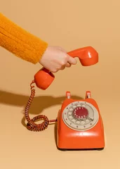 Fotobehang Oude deur Woman answering an old retro telephone
