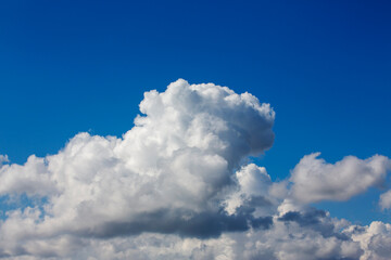 White clouds cumulus floating on blue sky for backgrounds concept