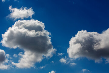 White clouds cumulus floating on blue sky for backgrounds concept