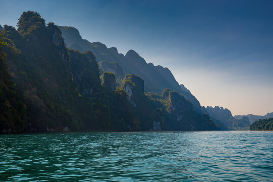 Limestone mountains with trees in the sea in Thailand