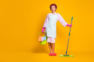Oh no many chores . Upset girl hold bucket mop look copyspace wear bath robe isolated bright color background