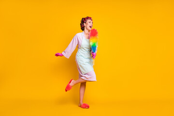 Full size profile side photo of crazy maid sing song fluffy duster mic wear gloves isolated shine color background
