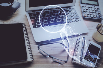 Desktop computer background in office and start up theme hologram drawing. Double exposure. Startup...