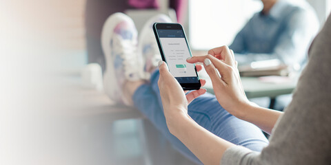 Woman making a financial payment on her phone