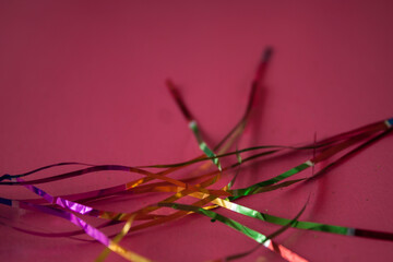 Christmas magical shimmer festive glittering shiny golden sparkle metal foil vibrant holographic gala party decoration tinsel glow background and texture.