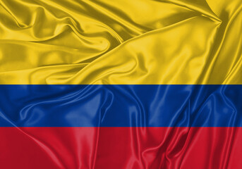 Colombia flag waving in the wind. National flag on satin cloth surface texture. Background for international concept.
