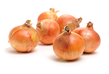 Gold onion vegetable bulbs on white background