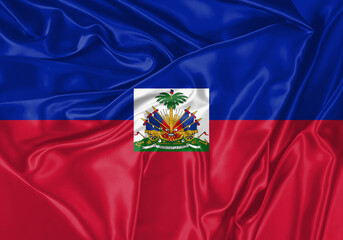 Haiti flag waving in the wind. National flag on satin cloth surface texture. Background for international concept.