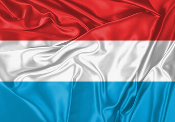 Luxembourg flag waving in the wind. National flag on satin cloth surface texture. Background for international concept.