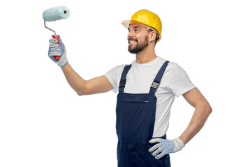profession, construction and building - happy smiling male worker or builder in yellow helmet and overall with paint roller over white background