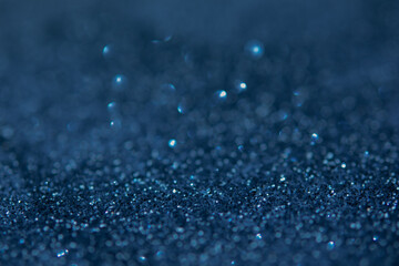 blurred abstract sparkling blue bokeh background. festive decoration for website banner and card concept. soft focus