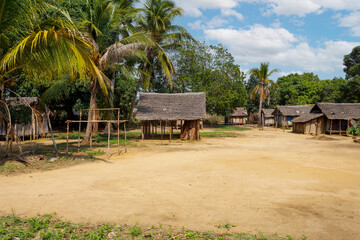 Traditional wooden african malagasy hut with roof from straw, typical village in north west Madagascar. Madagascar landscape.