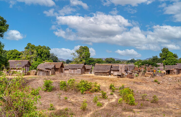 Traditional wooden african malagasy hut with roof from straw, typical village in north west Madagascar. Madagascar landscape.