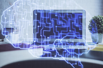 Double exposure of work space with computer and human brain drawing hologram. Brainstorm concept.