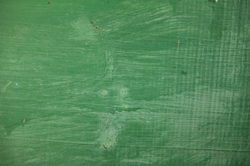 Closeup top view color flatlay photography of painted in green color old blank wooden surface