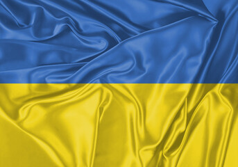 Ukraine flag waving in the wind. National flag on satin cloth surface texture. Background for international concept.