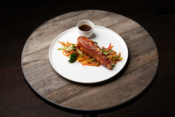 Teriyaki salmon on white plate. Salmon Teriyaki