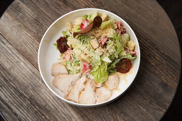 Caesar Salad with grilled chicken breast and parmesan cheese