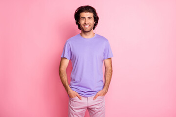 Photo of bearded man hands pockets toothy smile wear purple shirt trousers isolated pastel pink color background