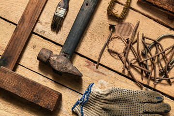 Old vintage household hand tools still life on a wooden background in a DIY and repair concept