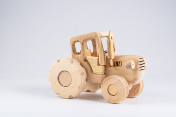 wooden kids excavator tractor toy isolated on white background, close view 