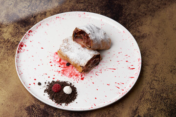 Strawberry biscuit roll with  berry syrup and fromage frais