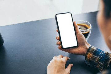 cell phone blank white screen mockup.woman hand holding texting using mobile on desk at office.background empty space for advertise.work people contact marketing business,technology