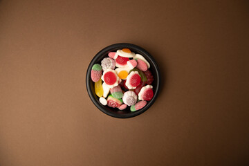 candy, sugar on black bowl