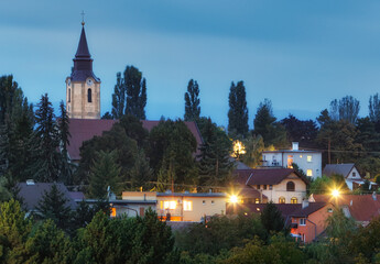 Village Budmerice at night with church, Slovakia