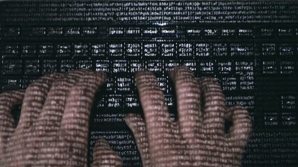 Male hands (hacker) quickly type on a computer keyboard on the surface of which various letters and numbers run, symbolizing the modern digital world - Powered by Adobe