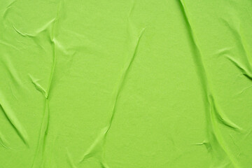 green crumpled and creased paper poster texture background