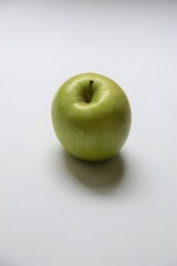 Single ripe green apple on white background