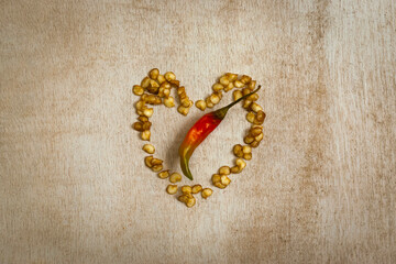 Red chili in between the heart shape seeds