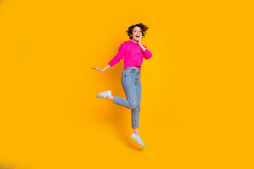 Fototapeta na wymiar Full length photo of funky lady jump high wear pink pullover isolated yellow color background