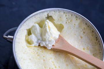 Turkish and Greek traditional dairy food yogurt or yoghurt in a pot (Goat yogurt)