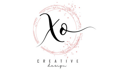 Handwritten XO X O letter logo with sparkling circles with pink glitter.