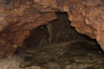 Crimea / Russia. red cave inside. Stalactites and stalagmites