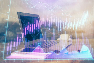 Stock market graph and table with computer background. Multi exposure. Concept of financial analysis.