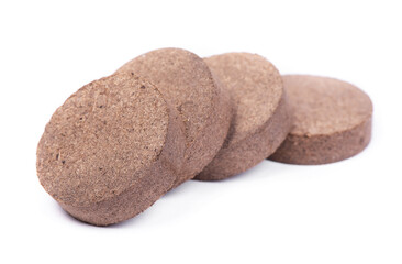 Dry peat pellets, compressed compost tablet