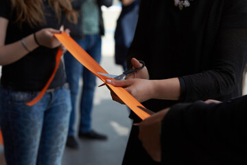 Solemn orange ribbon cutting. Solemn opening ceremony